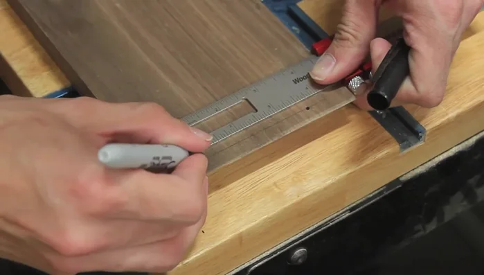 Drill recesses for brass plugs before assembly (if possible).