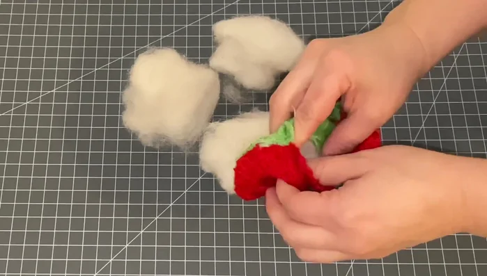 Remove stuffing and squeaker from the old dog toy.