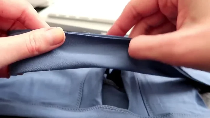 Attach neck and belly cuffing: Fold cuffing strips in half (wrong sides together), sew ends together, pin to the shirt edges, sew and topstitch.