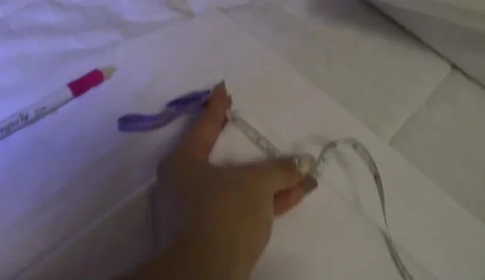 Glue crystals onto the tufted headboard using E6000 glue.