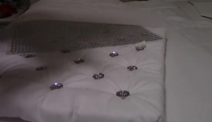 Create and attach a smaller mattress, similarly covered in fabric.