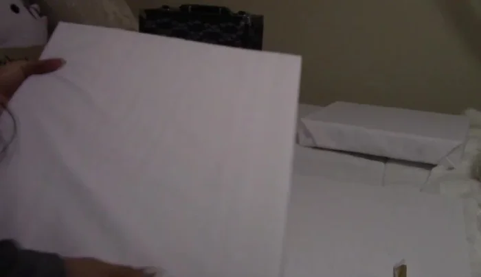 Add a decorative dog bone design to the mattress using crystals and tacky glue.