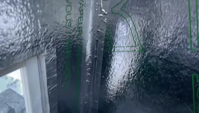 Add a clear vinyl layer as an additional door flap to reduce drafts.