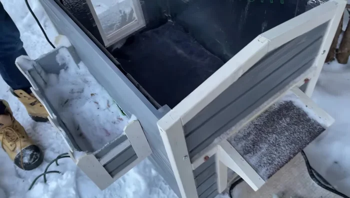 Add a clear vinyl layer as an additional door flap to reduce drafts.