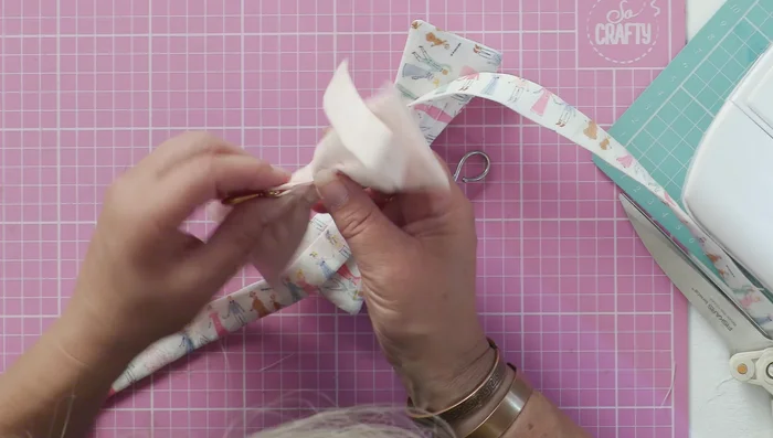 Hand stitch the turning gap on the collar closed.