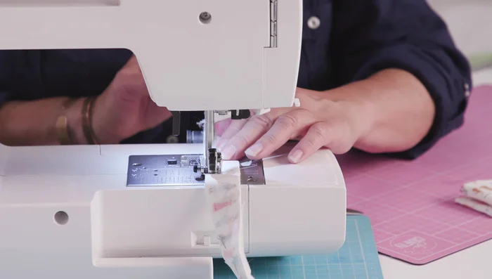 Hand stitch the turning gap on the collar closed.