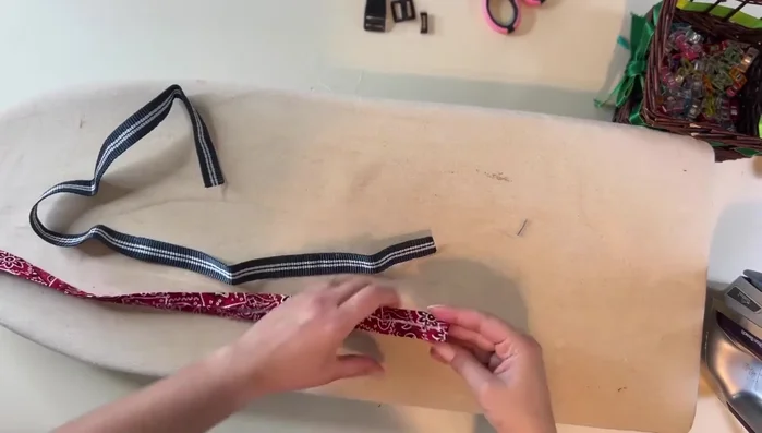 Attach webbing to fabric: Place the fabric on top of the webbing and edgestitch all the way around.