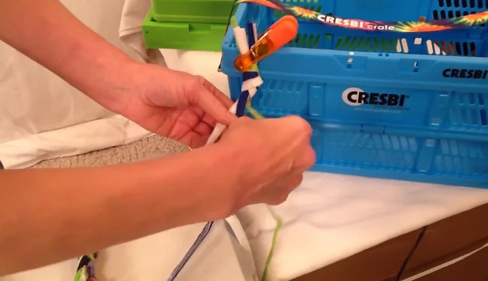 Braid each set of three strands tightly. Clamp or tie the end of each braid to prevent unraveling.