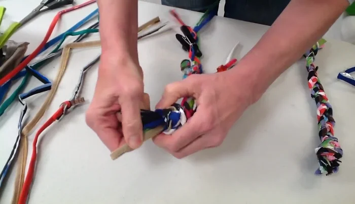 Braid the three braids together tightly. Tie another tight knot at the end. Trim any loose ends.