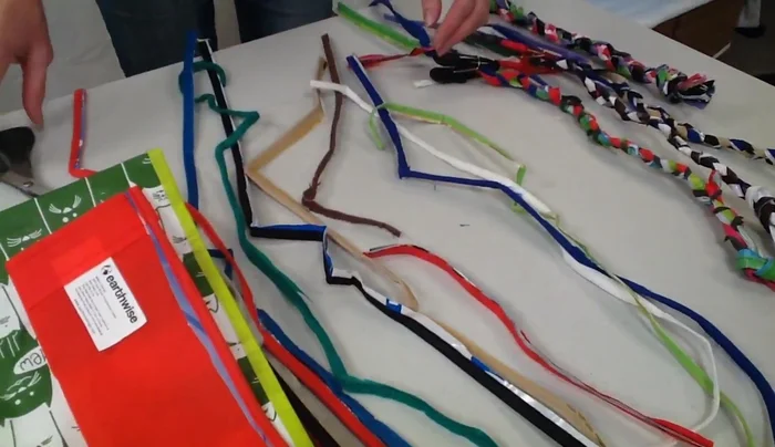 Divide the strands into three sets of three. Trim the corners to make them straight. If a strand is too short, add more length using a square knot.