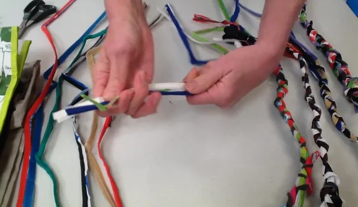 Braid each set of three strands tightly. Clamp or tie the end of each braid to prevent unraveling.