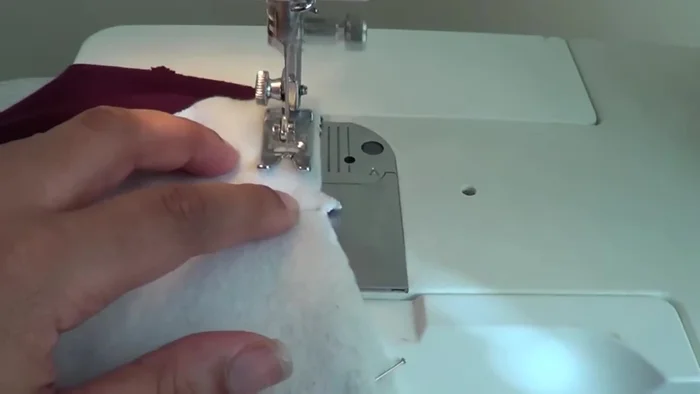 Split the seam open and sew over it to reduce bulk.