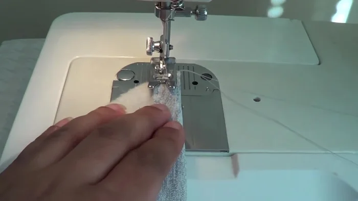 Sew up the back of the hood and then attach it to the neckline of the jacket, matching notches.