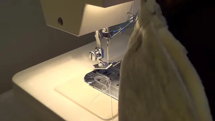 Attach the bottom band, stretching it to fit, and matching notches.