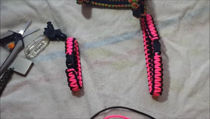 Join the neck and body pieces. Thread the paracord from the neck piece through the creased section of the body piece, then back up through a loop to secure it. Repeat on the other side.