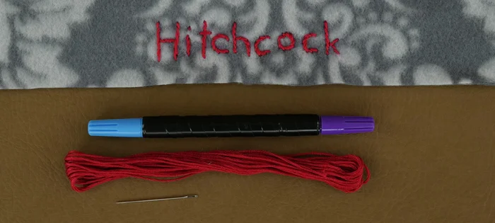 Optional: Personalize the bed with embroidery. Use a fabric marker to draw your design (e.g., pet's name) on one of the strips, ensuring sufficient distance from the edges for seam allowance. Use a stem stitch for lettering.