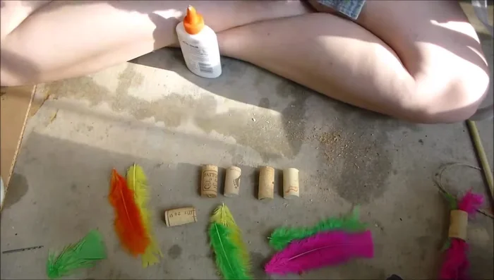 Insert feathers into the holes, ensuring glue isn't visible on the outside.