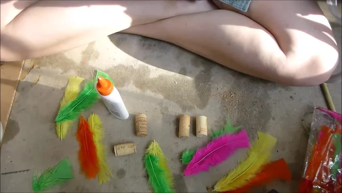 Insert feathers into the holes, ensuring glue isn't visible on the outside.