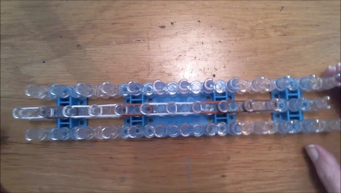 Use double loops for the remaining bands, starting with a single dark brown band.