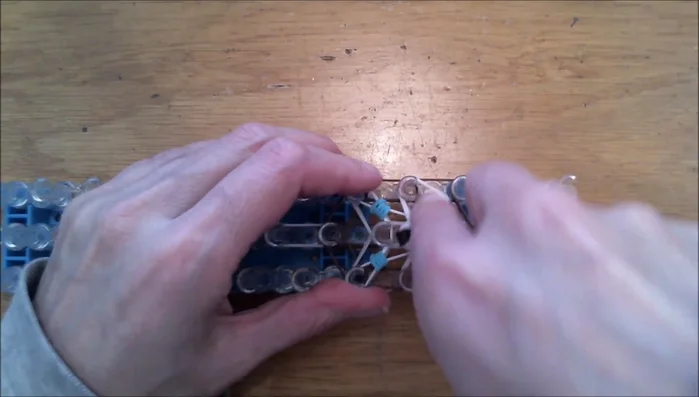 Assemble the dog's face by attaching the ears, eyes, nose, and snout.