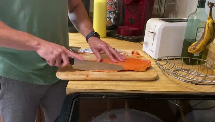 Cut the salmon into thin, even slices. Thinner slices dehydrate more evenly.
