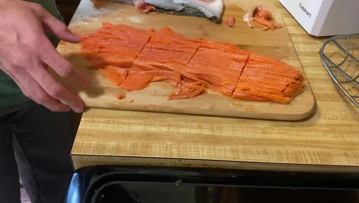 Optional: Create salmon skin treats by thinly slicing the skin and rolling it up.