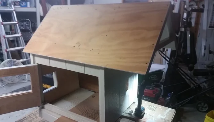 Build a sturdy cat house: Utilize scrap building materials to construct a more permanent and insulated structure. Purchase necessary items like shingles, insulation, trim, a cat door, and hinges.