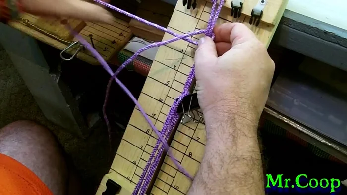 Tighten the knot after securing the loop, locking in the handle. Repeat this process once more for added security.