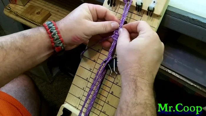 Tighten the knot after securing the loop, locking in the handle. Repeat this process once more for added security.