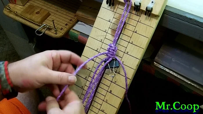 Tighten the knot after securing the loop, locking in the handle. Repeat this process once more for added security.