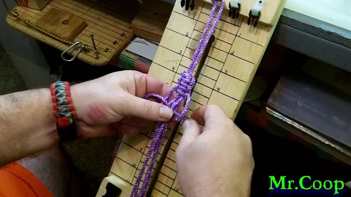 Tighten the knot after securing the loop, locking in the handle. Repeat this process once more for added security.