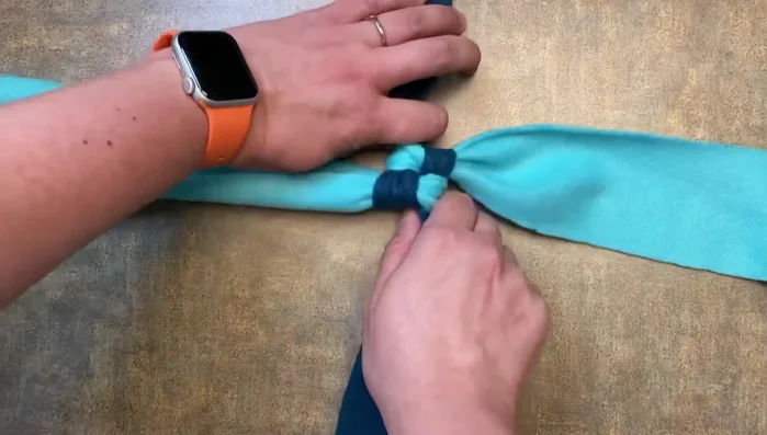 Continue repeating steps 2-6 until the desired length of the toy is achieved.