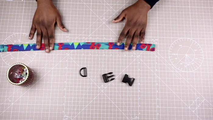 Attach the buckle: Insert the collar (right side down) into the first opening of the buckle (curved side facing up) furthest away, then pull it through to the middle buckle, reaching the triglide. Insert the collar into the second opening.