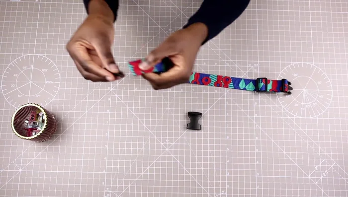 Attach the D-ring: Place the collar right side up and insert the D-ring (curved part facing up).