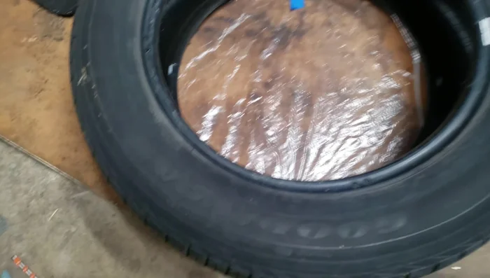 Wrap plastic around the tire to prevent water from entering. Secure with gorilla glue.