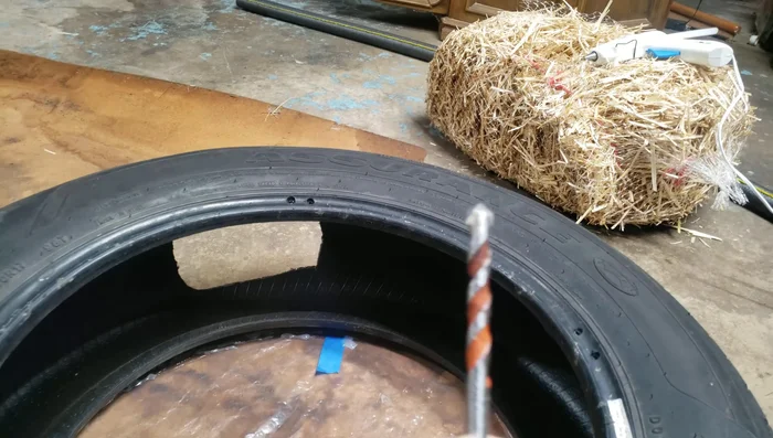 Use twist ties to attach the top and bottom circles to the tire through the drilled holes.
