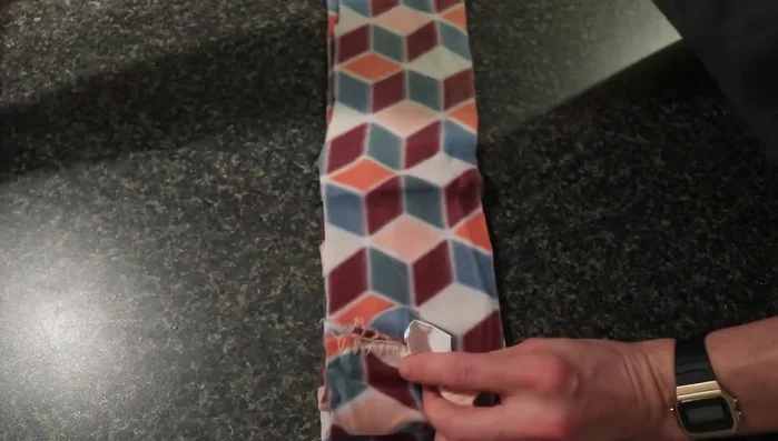 Prepare strips for braiding: Gather four strips of equal length. Tie a knot at one end, ensuring all the strips are included and the knot is secure.