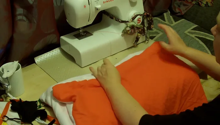 Optional: Create armholes. Cut angles at the sides of the rectangle and fold them over for a cleaner finish. If the costume is going under the arms, use ribbon to support it.