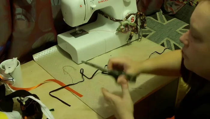 Attach the elastic: Sew the elastic to create a neckline.