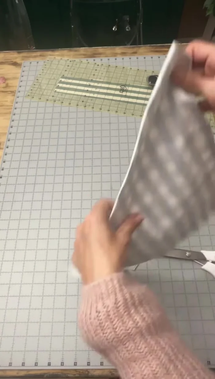 Fold in the side edges again. 