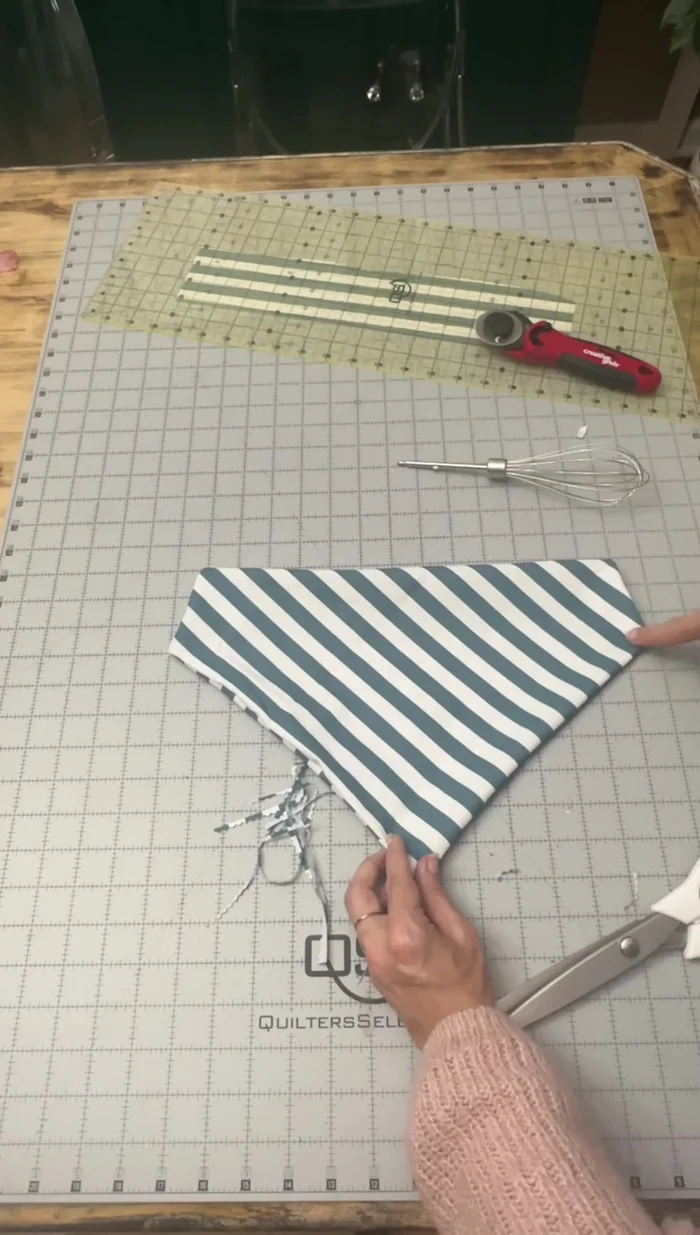 Sew a line across the top, securing the folded edges. (Optional: Draw a guideline with an air erasable marker).