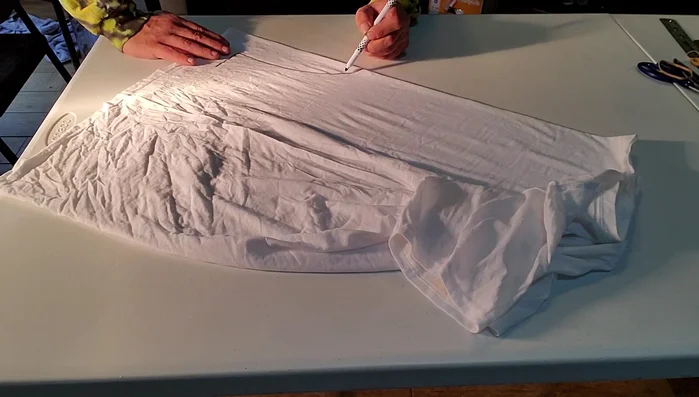 Draw a heart for the kitty's face, and other details like feet.