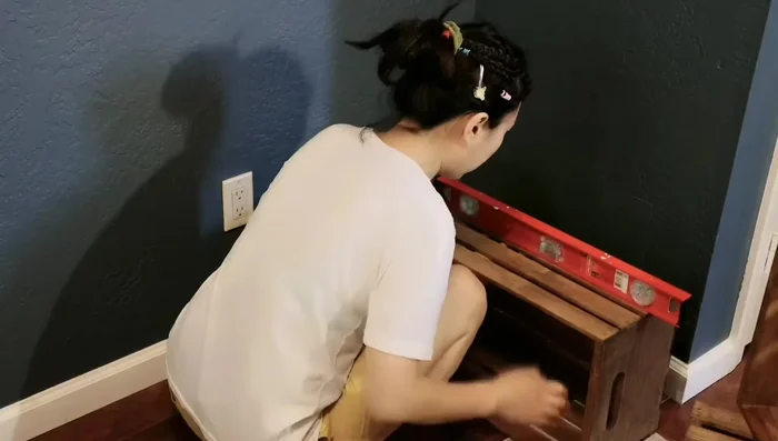 Install anchors into the wall using a hammer.