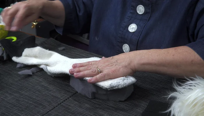 Flip the sock right side out. The foam should create a 3D mouth shape.