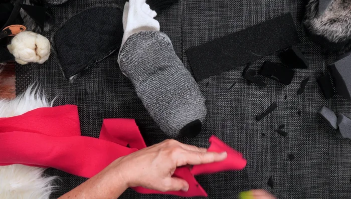 Create a tongue from felt, and glue it into place. 