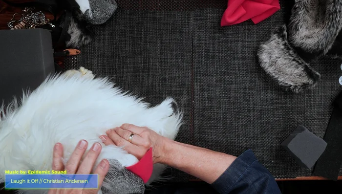 Cover the head with fur fabric, gluing it around the nose and down to the neck. 