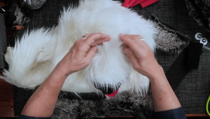 Use pieces from an old hat to create ears, gluing them to the top of the head and shaping them as desired.