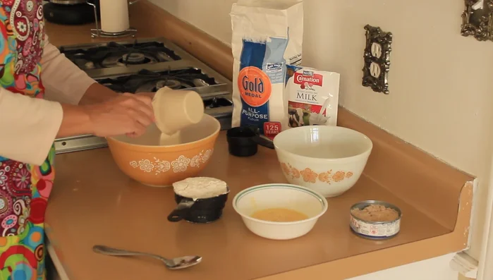 In one bowl, combine 1 cup dry milk and 1 cup flour.