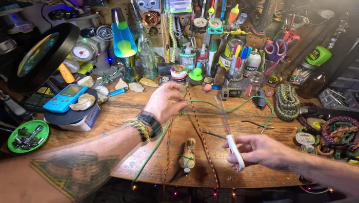 Attach to the stick: Secure the loop to the drilled hole using a zip tie.