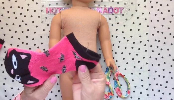 Create a cardigan from a sock: Cut down the middle of the sock, remove a small section from the heel, and hand-hem.